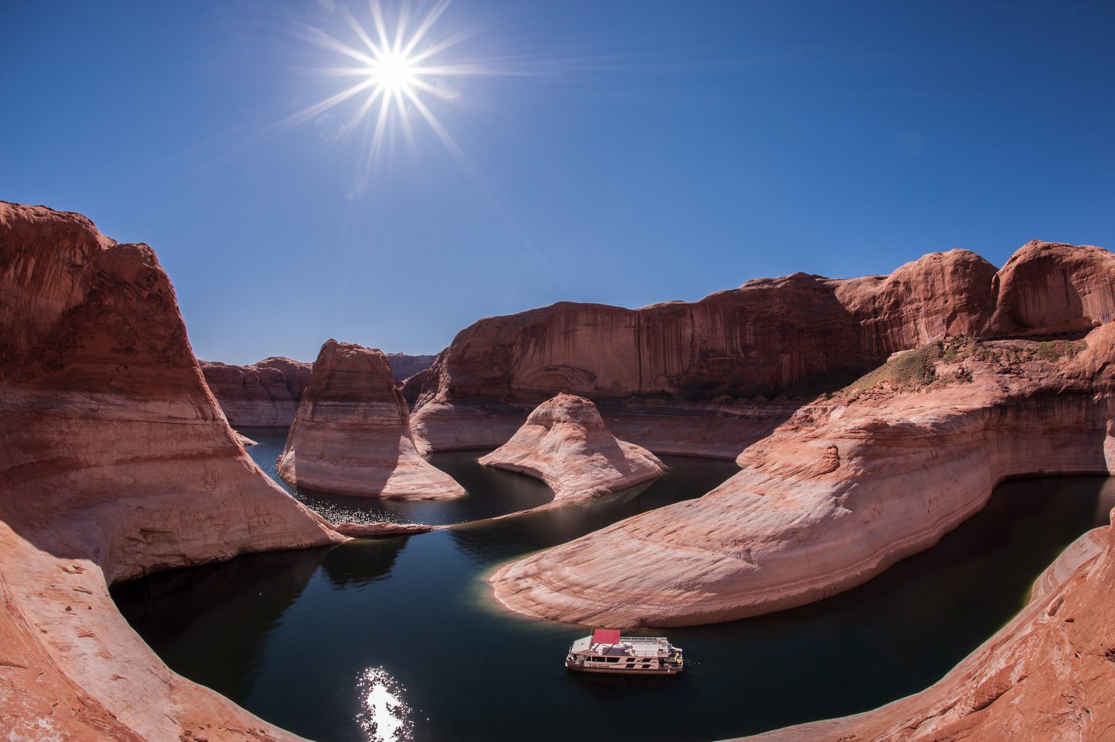A houseboat in a side canyon of Lake Powell